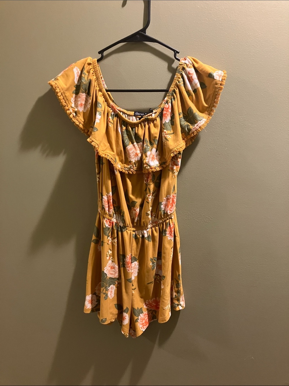 Girls one piece outfit neckline with brand tag